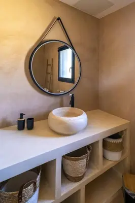 a bathroom with a sink and a mirror on a counter at Villa Renajolo 16 pers piscine chauffée 2 min plage en voiture in Sainte-Lucie de Porto-Vecchio