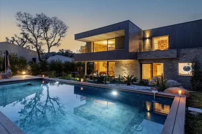 a house with a swimming pool in front of it at Villa Renajolo 16 pers piscine chauffée 2 min plage en voiture in Sainte-Lucie de Porto-Vecchio