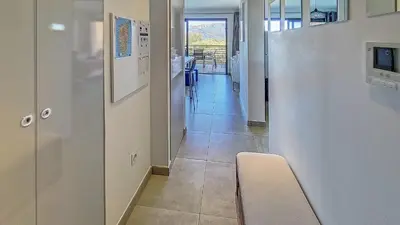 a hallway of a hospital with a hallway at Appartement de standing avec piscine et terrasse in Porto-Vecchio