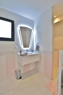 a bathroom with a sink and a mirror at Domaine de Pacciolello - Porticcio in Porticcio