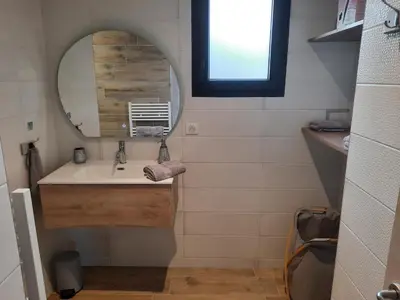 a bathroom with a sink and a mirror at Domaine de Pacciolello - Porticcio in Porticcio