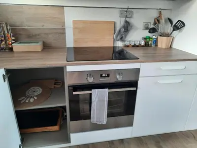 a kitchen with a stove and a counter top at Domaine de Pacciolello - Porticcio in Porticcio