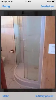 a shower with a glass door in a bathroom at Maison Le Guetali in Sainte-Lucie de Porto-Vecchio
