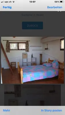a picture of a bedroom with a bed in a room at Maison Le Guetali in Sainte-Lucie de Porto-Vecchio