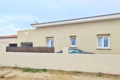 a car parked in front of a house at Magnifique villa avec piscine en bord de Mer in Lucciana