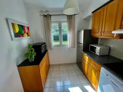 a kitchen with a sink and a microwave at Casa in Cervione