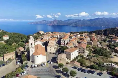 an aerial view of a town next to the water at Appartement dans maison de village in Piana