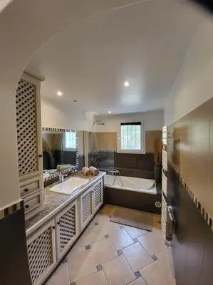 a large bathroom with two sinks and a tub at Casa Marcelli 5 in Porto-Vecchio