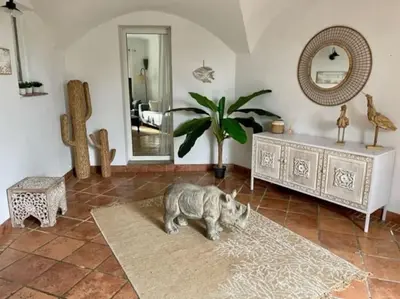 a dog laying on a rug in a living room at Villa Valentine by Intendance Excellency in Porto-Vecchio