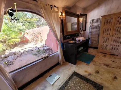 a bathroom with a sink and a large window at Casa Salya 8 pers Piscine privée Chauffée San Cipriano in Lecci
