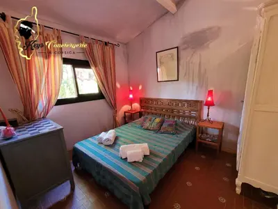 a bedroom with a bed with two towels on it at Casa Salya 8 pers Piscine privée Chauffée San Cipriano in Lecci