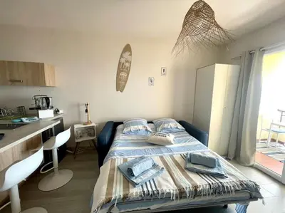 a bedroom with a bed with towels on it at A Piaghja, refuge romantique face à la mer in Ajaccio