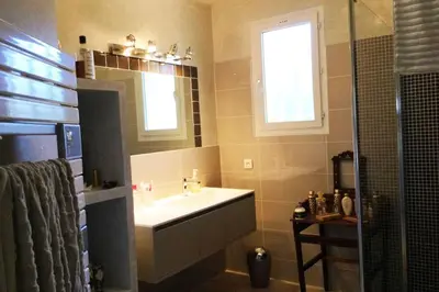 a bathroom with a sink and a window and a shower at Villa Roccu in Borgo