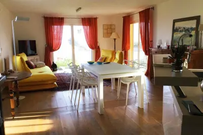 a living room with a white table and chairs at Villa Roccu in Borgo