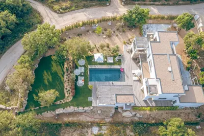 an aerial view of a house with a swimming pool at Villa Bambou 12 pers piscine chauffée 10 minutes à pieds plage in Sainte-Lucie de Porto-Vecchio