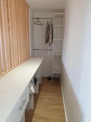 a walk in closet with a white counter and shelves at Studio Venaco Centre Corse in Venaco