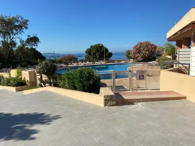a view of a swimming pool from a house at F2 vue mer dans résidence avec piscine in Ajaccio