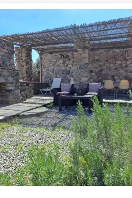 an outdoor brick oven with a stone wall at Maison en pierre corse avec vue entre mer et montagne in Moltifao