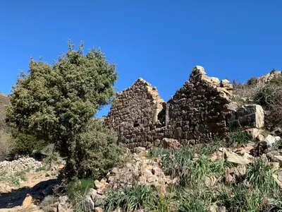 an old abandoned building with a large room with at Maison en pierre corse avec vue entre mer et montagne in Moltifao