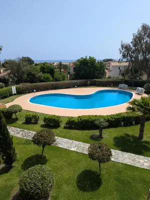 an overhead view of a swimming pool in a garden at Splendide vue Mer in Linguizzetta