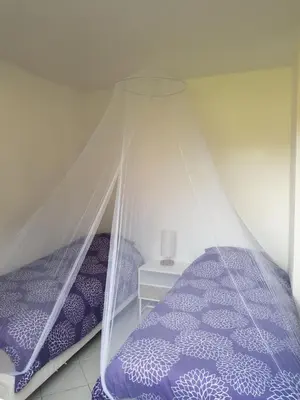 a bedroom with two beds under a tent at GIORGHA VILLA Piscine chauffée 15 pers avec piscine vue mer montagne 1km mer in Solaro