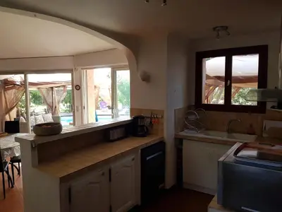a kitchen with a sink and a counter top at LA MARINE Piscine chauffée villa avec piscine 5 mn à pied de la mer in Solaro
