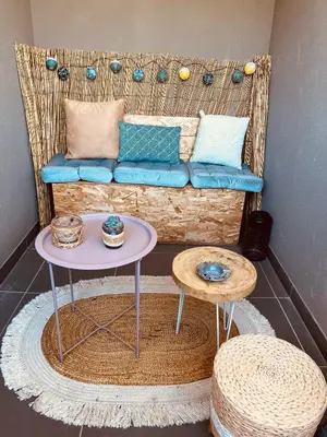 a living room with a couch and a table at SUPERBE STUDIO AVEC PLACE DE PARKING in Ajaccio