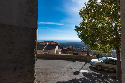 a view from the side of a house with a car at Pentone in Cervione