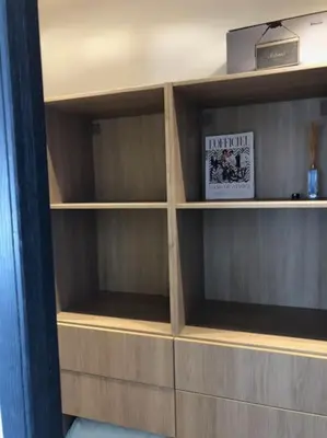 a wooden book shelf in a room at Maison en pierre Corse avec vue proche des Gorges de l'Asco entre mer montagne et piscine in Moltifao