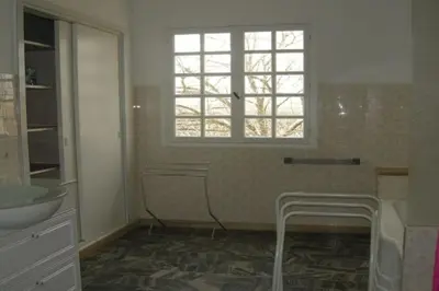 a bathroom with a sink and a window at Appartement 8 pers. - Domaine de Padulone ALERIA in Aléria