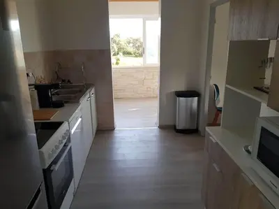 a kitchen with a sink and a stove top oven at OVU Piscine chauffée Entre mer et montagne à 1 km de la mer in Solaro