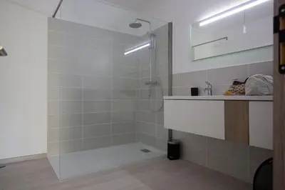 a bathroom with a shower and a sink at Villa MAYA in Lecci
