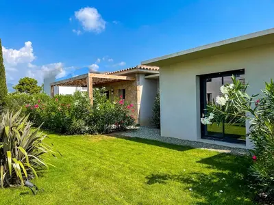 a house with a lawn in front of it at Villa MAYA in Lecci