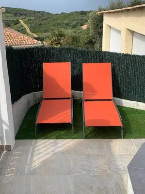 two orange chairs sitting next to a fence at Panorama exceptionnel sur les hauteurs de Propriano in Propriano