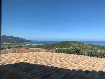 a view of a roof with the ocean in the background at Panorama exceptionnel sur les hauteurs de Propriano in Propriano