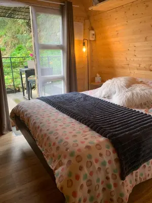 a bedroom with a bed and a window and a table at U Sognu 3128 in Muro