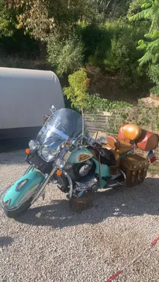 a motorcycle with a sidecar parked on the road at U Sognu 3128 in Muro