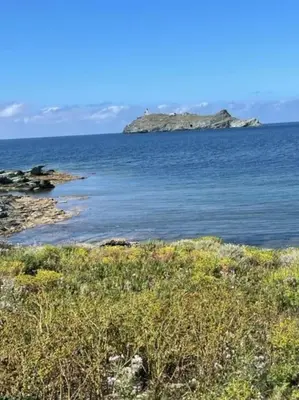 an island in the middle of a large body of water at Appartement tout confort 2-4 pers 500 m de la plage avec piscine et wifi in Santa-Maria-Poggio