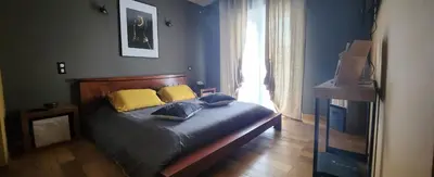 a bedroom with a bed with two pillows and a window at Chambre d'hôtes Casa Lucia in Furiani