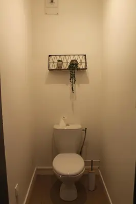 a bathroom with a white toilet in a room at Location Ajaccio in Ajaccio