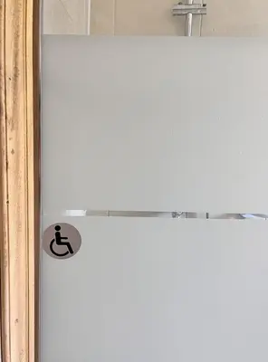 a white door with a sign on it at Residence Amanda in Santa-Lucia-di-Moriani