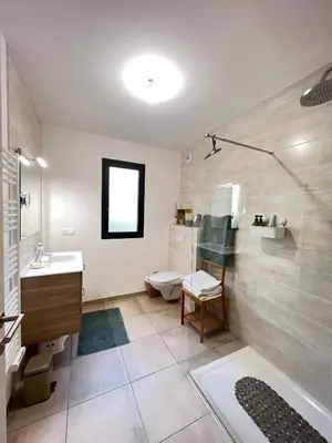 a bathroom with a shower and a sink and a toilet at BEL'ORIZONTE C, 100m des plages et vue mer in Propriano