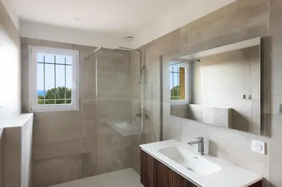 a bathroom with a sink and a shower at Costa Marina in Porto-Vecchio
