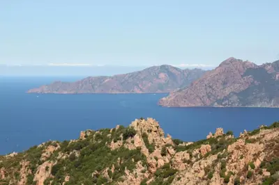 a view of a blue lake from a mountain at Appartement avec vue sur la montagne in Vico