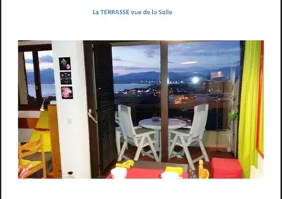 a view of a balcony with a table and chairs at Appartement terrasse 1 chambre in Porticcio
