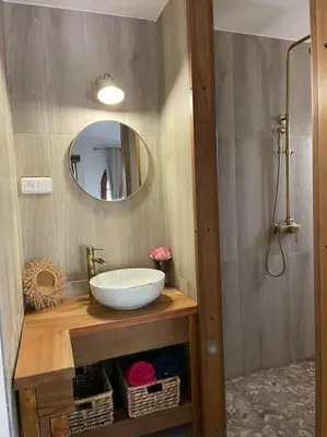 a bathroom with a sink and a mirror at BERGERIE LA NEPITA in Saint-Florent