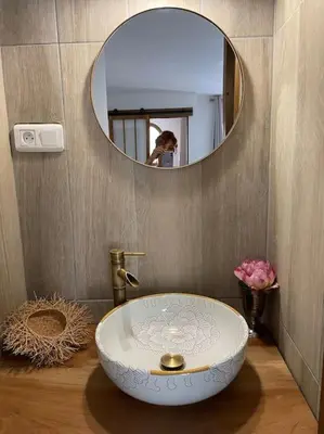 a bathroom with a bowl sink and a mirror at BERGERIE LA NEPITA in Saint-Florent