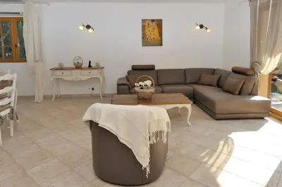a living room with a couch and a table at Domaine Finili in Cauro