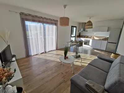 a living room with a couch and a table at Résidence Petra Paolina in Folelli
