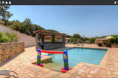 a pool with a slide and a gazebo at Maison CALM2 in Viggianello